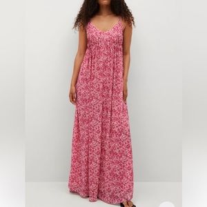 Beautiful flowing maxi dress with spaghetti straps that cross in the back